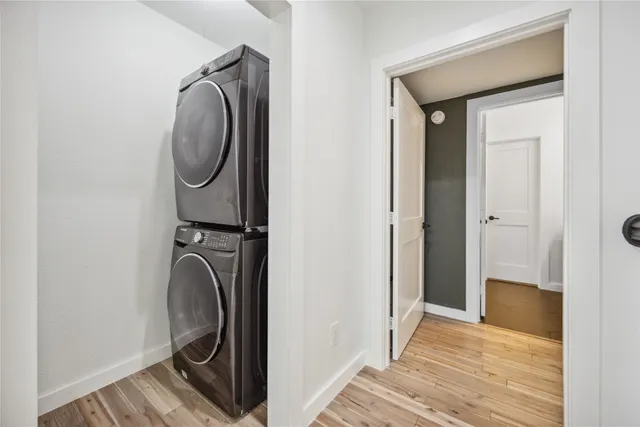 a view of a hallway with washer and dryer