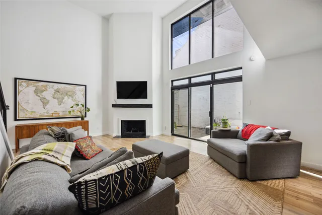 a living room with furniture fireplace and a flat screen tv