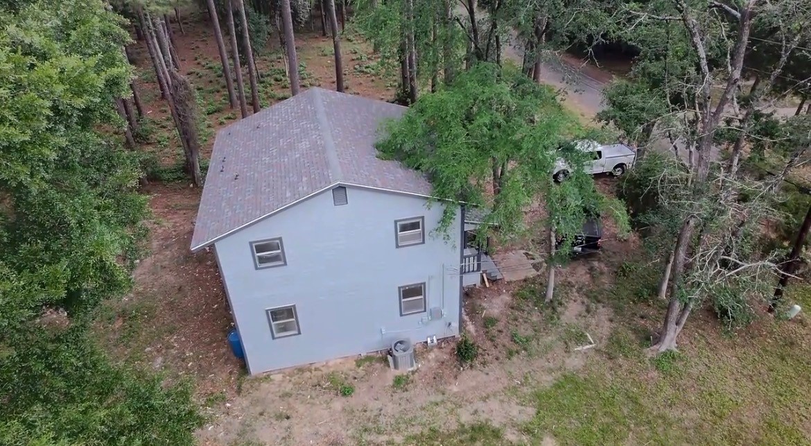 117 Amanda Street Conroe, TX 77304 - Photo 13 of 35 a view of a house with a yard and tree s