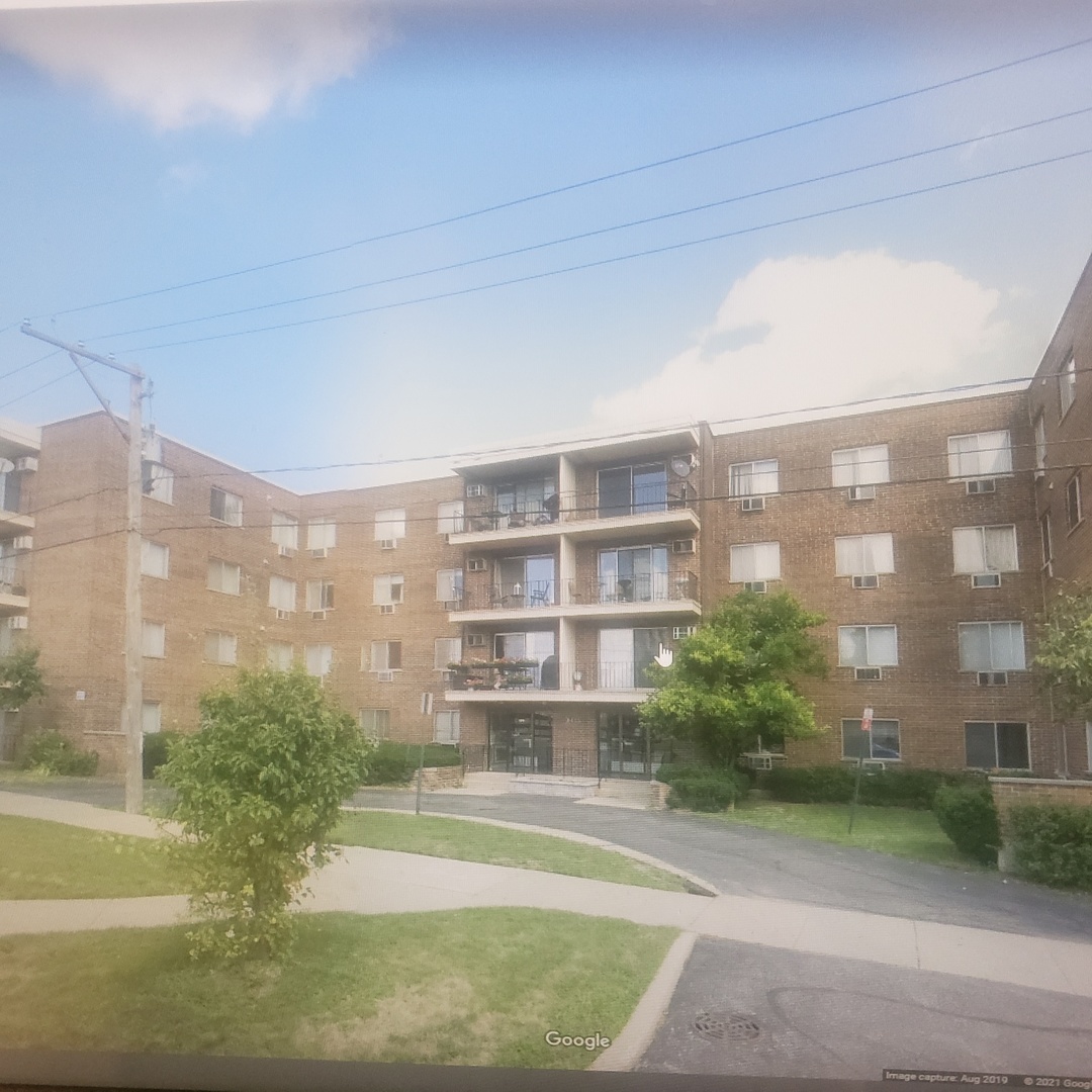 9445 Kenton Avenue, Unit P14 Skokie, IL 60076 - Photo 1 of 3 a view of a multi story building