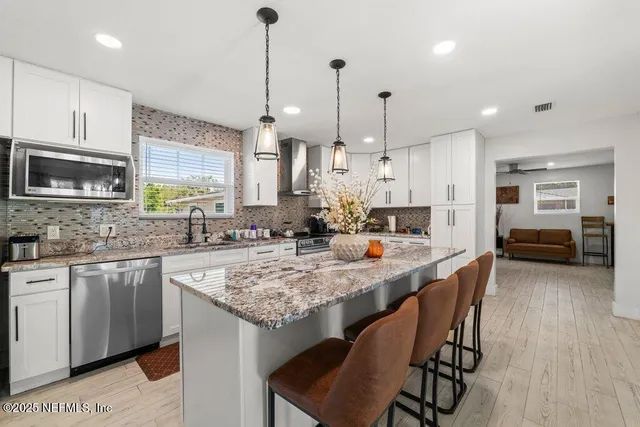 a view of a livingroom with furniture and window