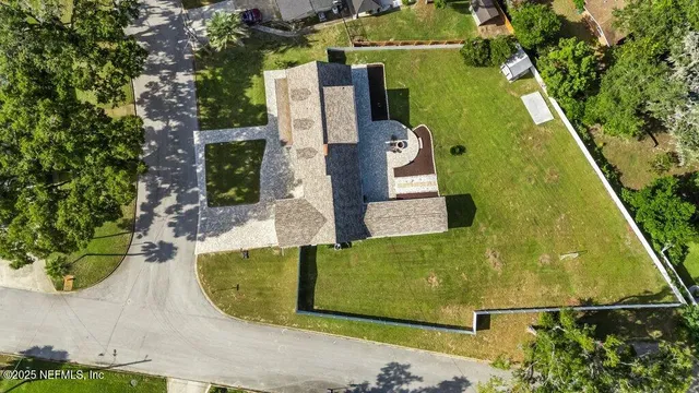 a view of a chairs and table in the patio