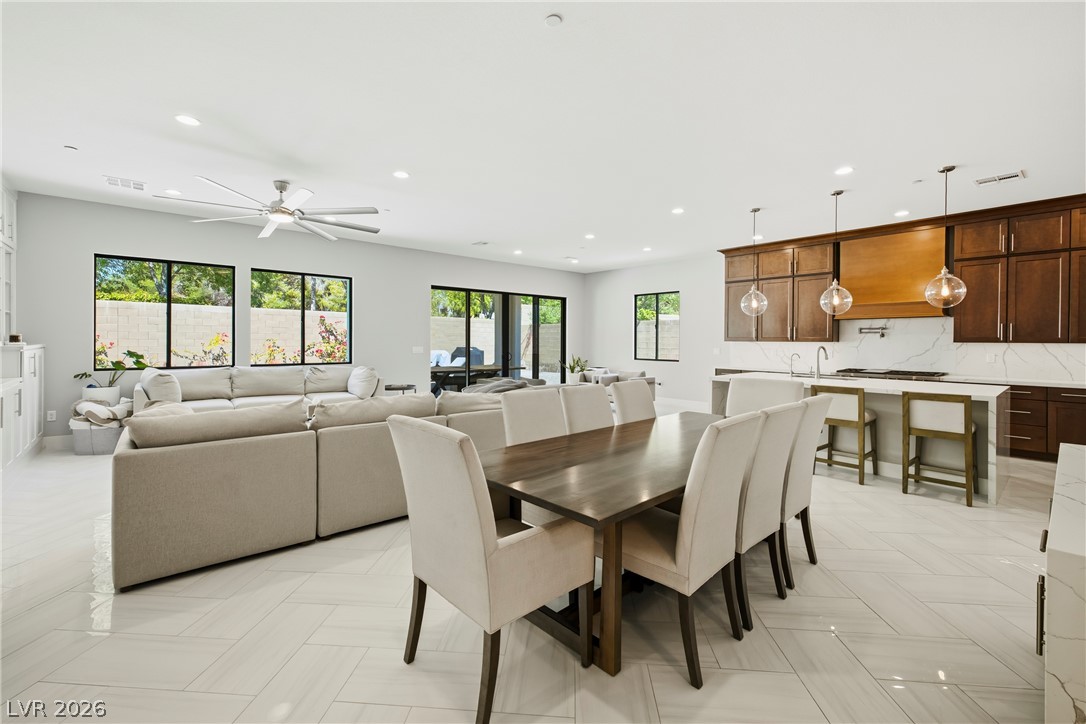 45 Garibaldi Way Henderson, NV 89011 - Photo 28 of 74 An open-concept living space integrates a well-appointed kitchen and dining area.