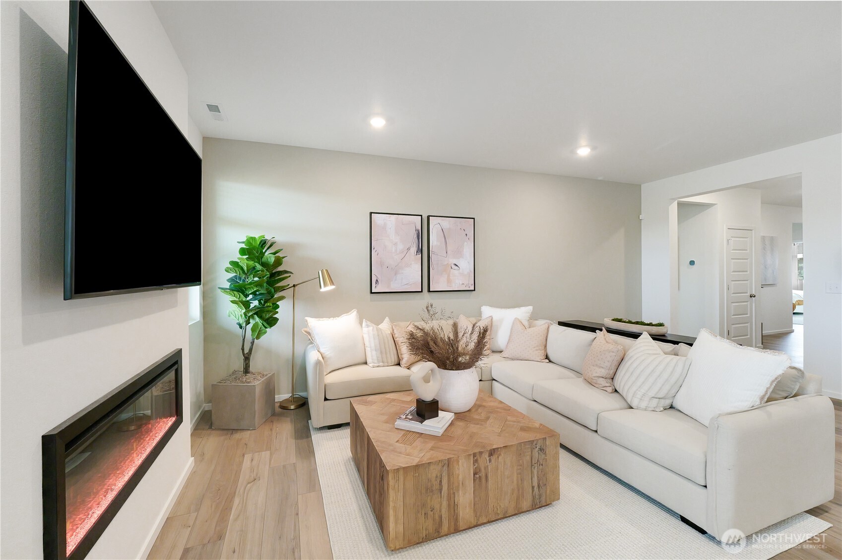 92 Moonshadow Lane Sequim, WA 98382 - Photo 12 of 27 a living room with furniture a flat screen tv and a fireplace