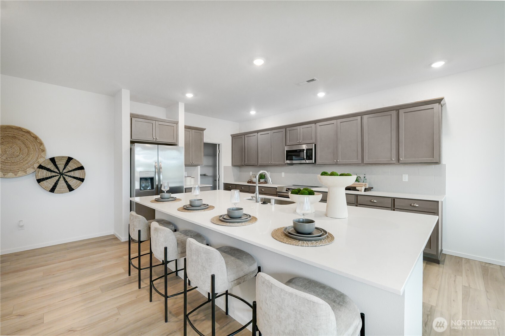 92 Moonshadow Lane Sequim, WA 98382 - Photo 2 of 27 a kitchen with a dining table chairs and wooden floor