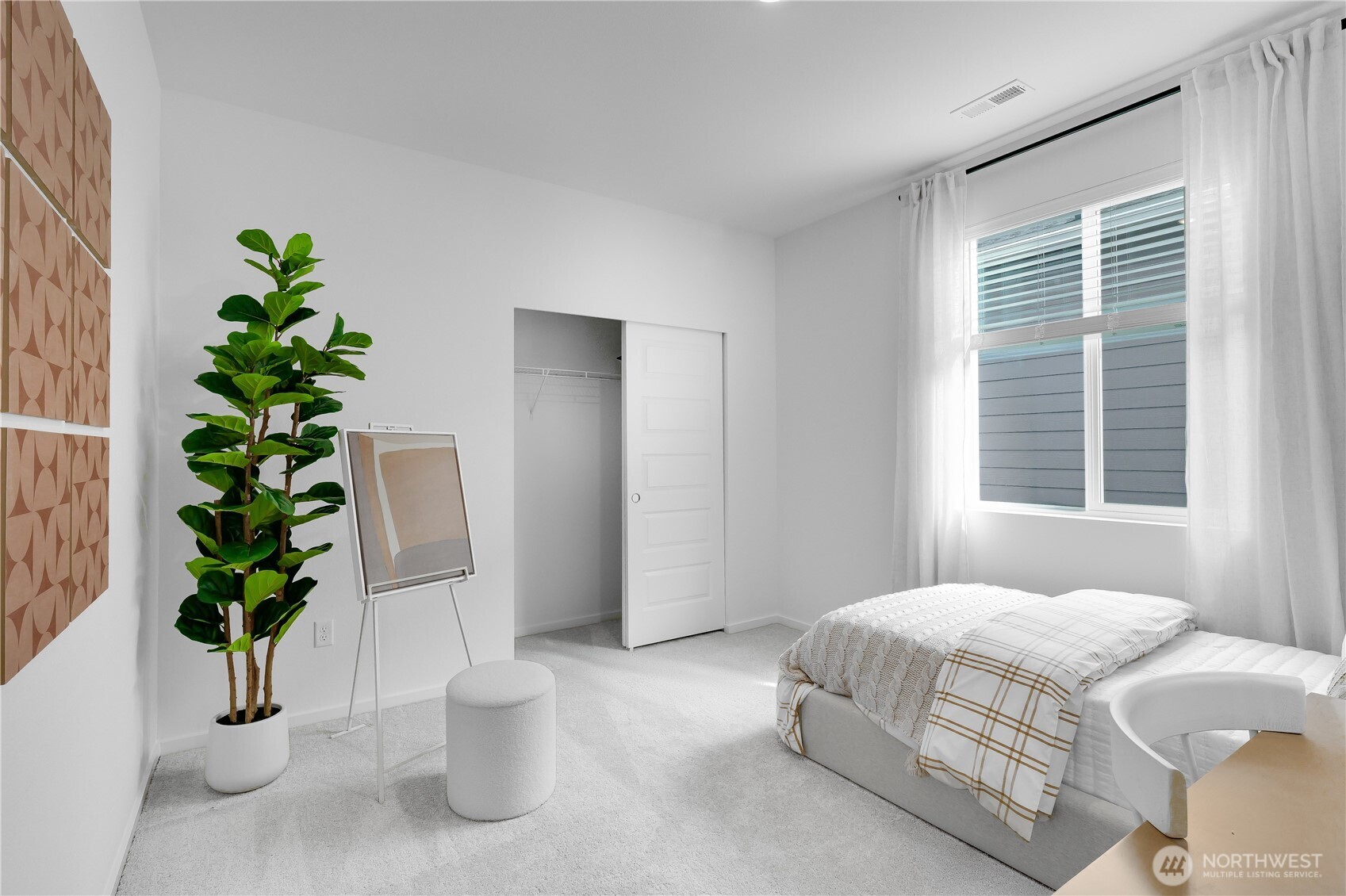 92 Moonshadow Lane Sequim, WA 98382 - Photo 25 of 27 a bedroom with a large potted plant and a window