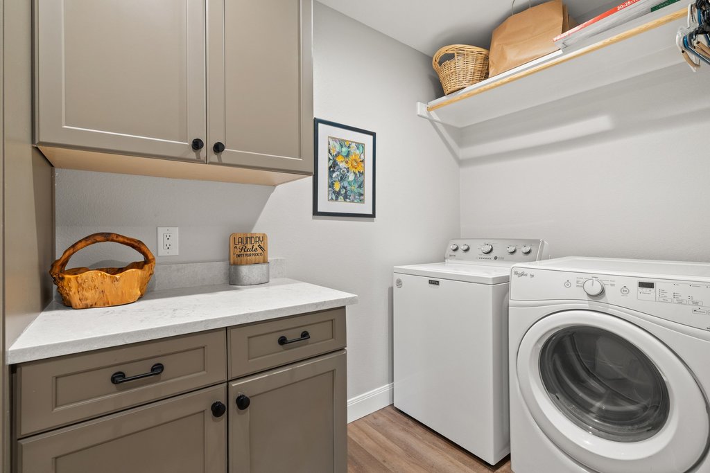 23644 Nameless Road Leander, TX 78641 - Photo 19 of 40 Functional laundry space featuring modern appliances and practical storage solutions.