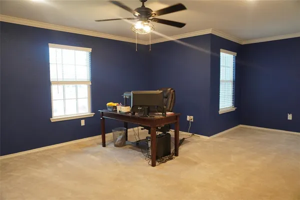 a workspace with furniture and window