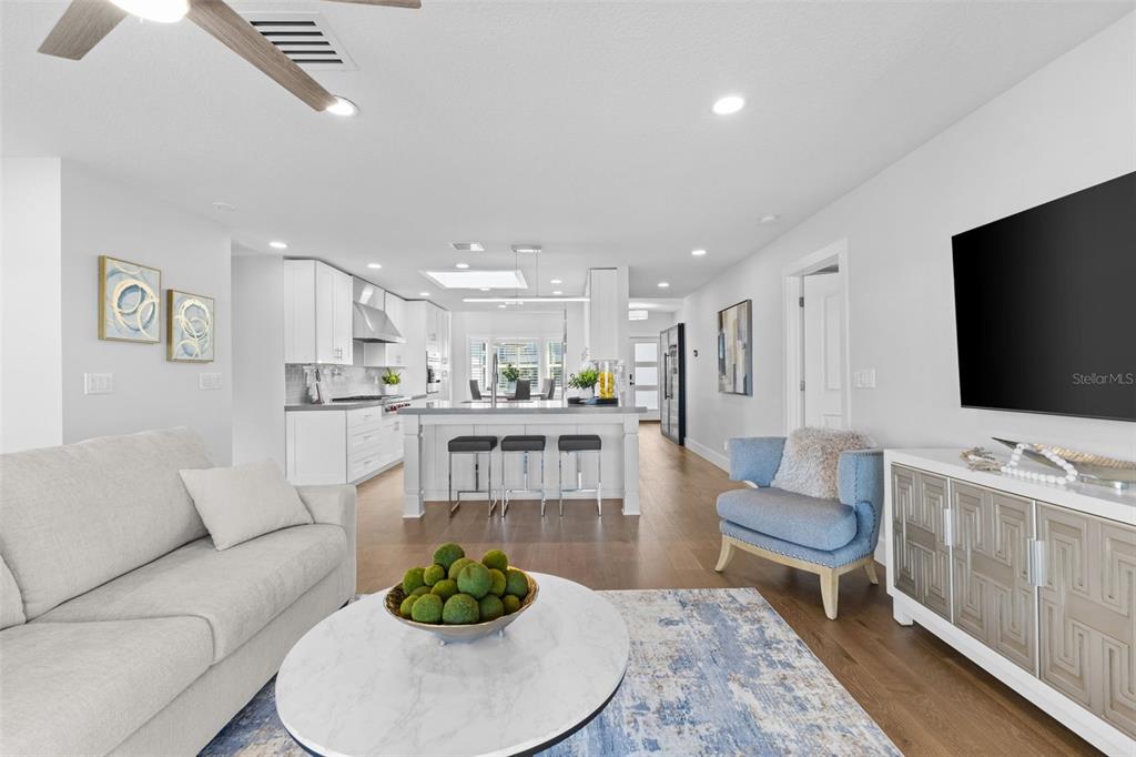 850 Bay Point Drive Madeira Beach, FL 33708 - Photo 11 of 59 a living room with furniture and a flat screen tv