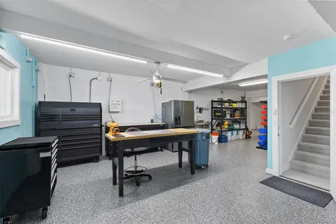 a view of a lake with couches and city view