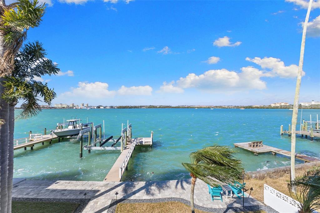 850 Bay Point Drive Madeira Beach, FL 33708 - Photo 53 of 59 a view of a lake with couches and city view