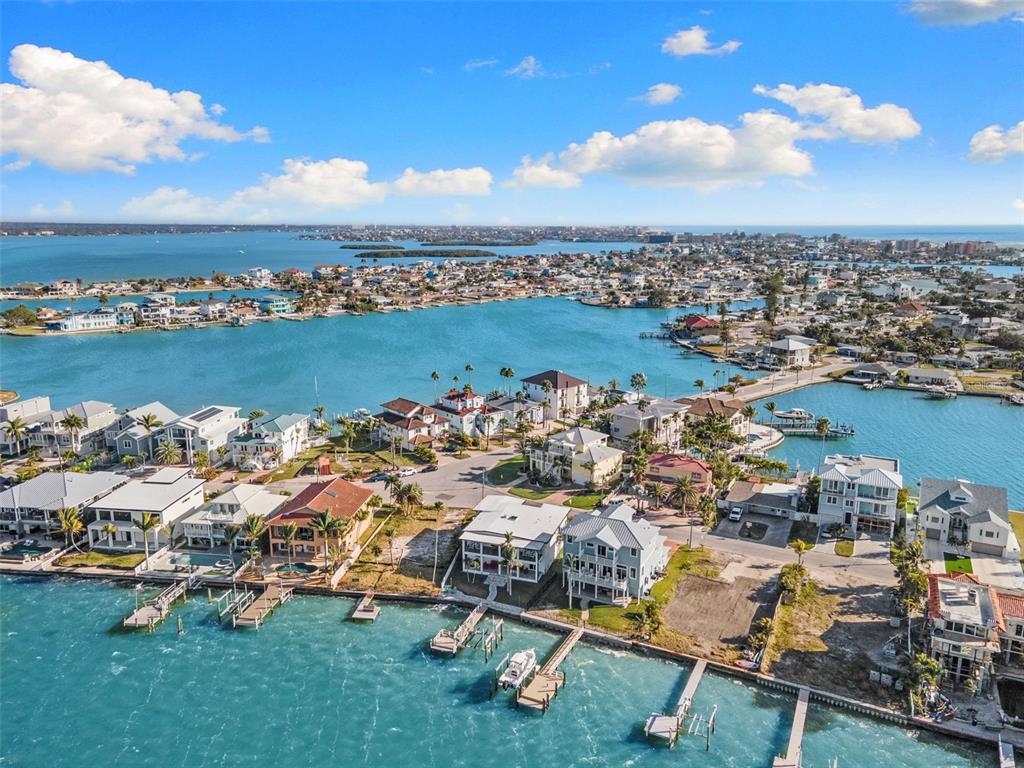 850 Bay Point Drive Madeira Beach, FL 33708 - Photo 58 of 59 an aerial view of a city with lots of residential buildings ocean and mountain view in back