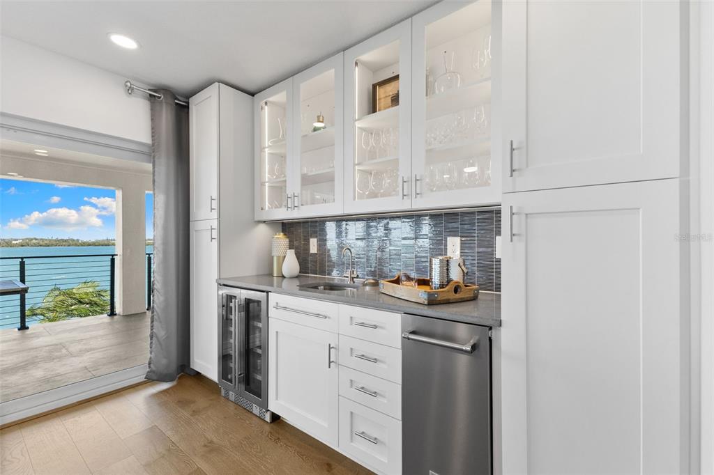 850 Bay Point Drive Madeira Beach, FL 33708 - Photo 6 of 59 a kitchen with stainless steel appliances a stove and a refrigerator