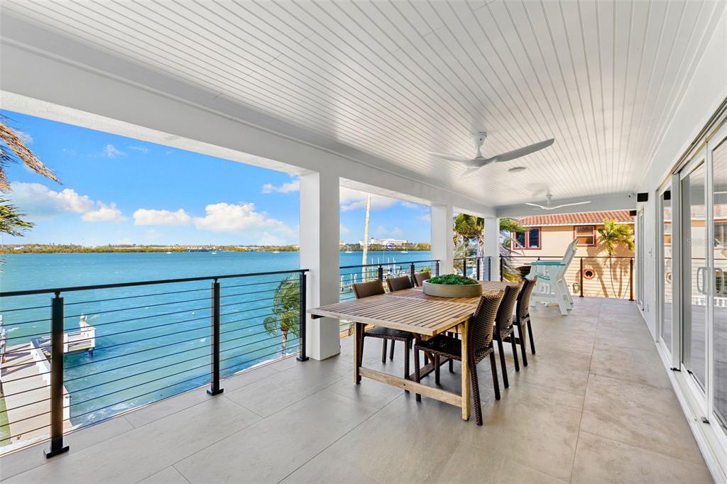 850 Bay Point Drive Madeira Beach, FL 33708 - Photo 9 of 59 a view of a patio with a table and chairs