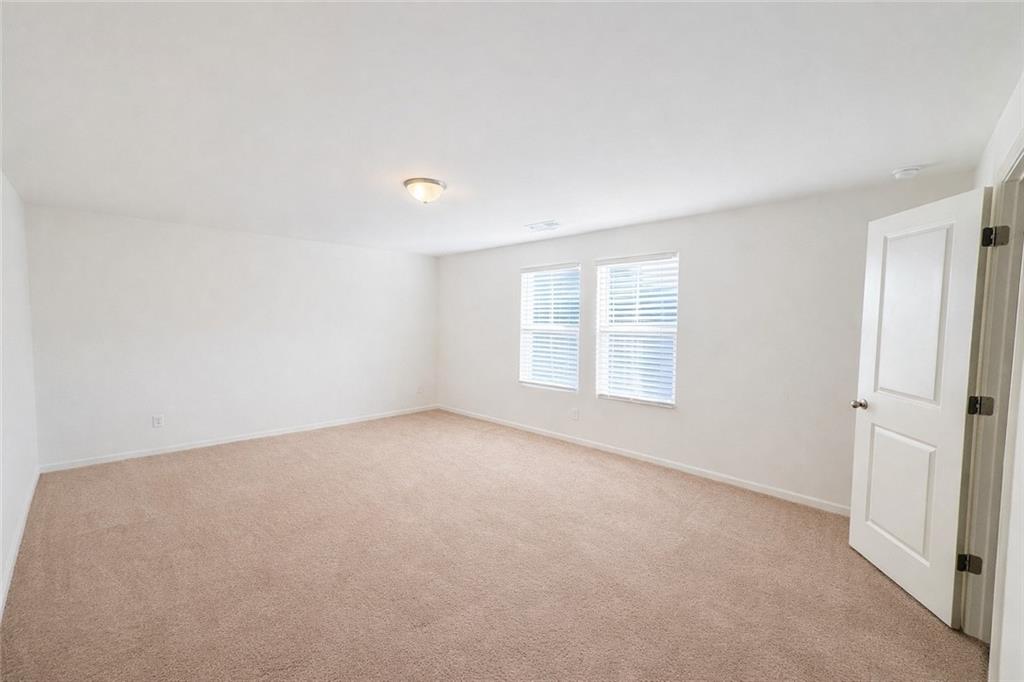 5075 Minnow Lane Cumming, GA 30028 - Photo 15 of 31 an empty room with windows