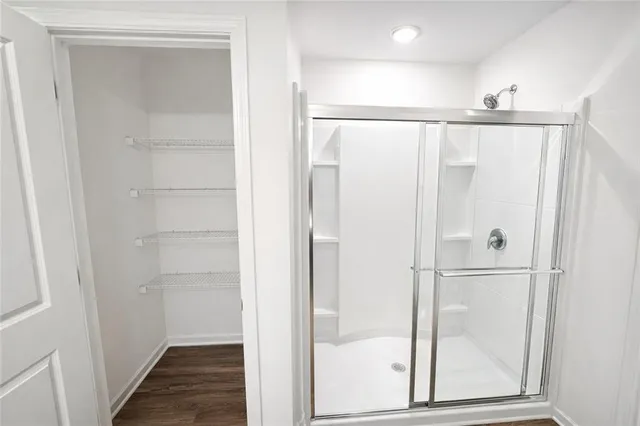 a bathroom with a glass shower door