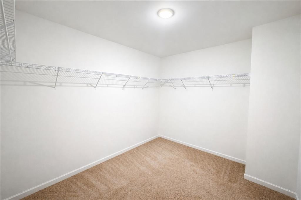 5075 Minnow Lane Cumming, GA 30028 - Photo 19 of 31 a view of a room with racks on the wall