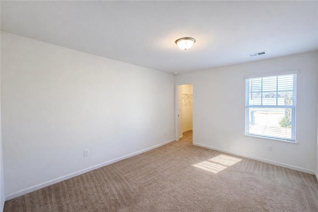 5075 Minnow Lane Cumming, GA 30028 - Photo 22 of 31 an empty room with windows