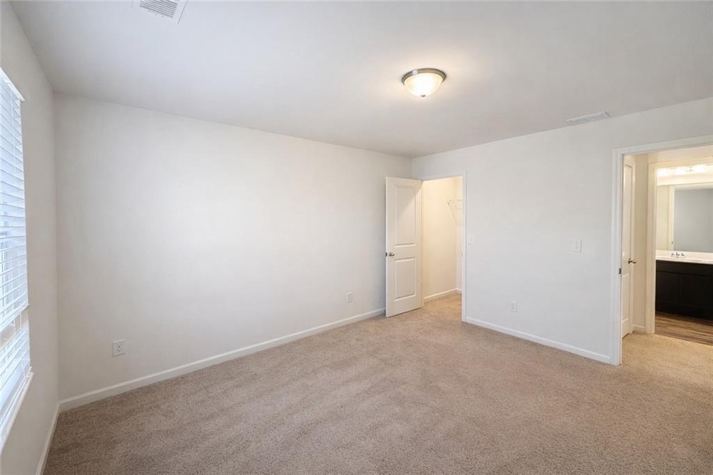 5075 Minnow Lane Cumming, GA 30028 - Photo 25 of 31 an empty room with windows