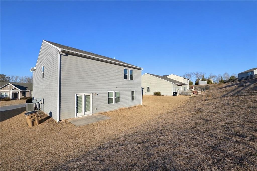 5075 Minnow Lane Cumming, GA 30028 - Photo 30 of 31 a view of a house with a backyard