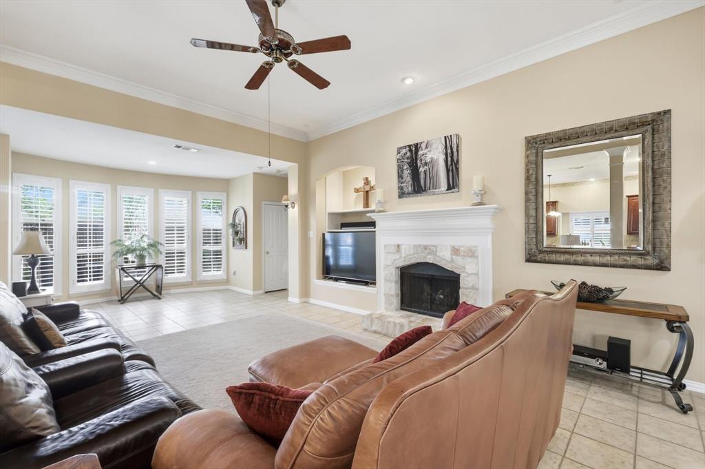 2012 Hayden Lane Corinth, TX 76210 - Photo 10 of 40 a living room with furniture and a fireplace
