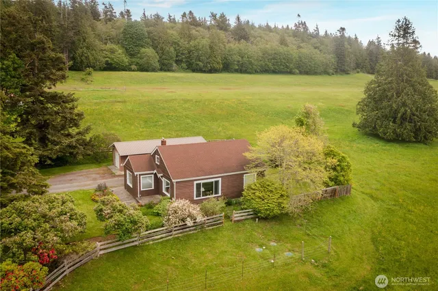 a aerial view of a house with pool lake view and mountain view