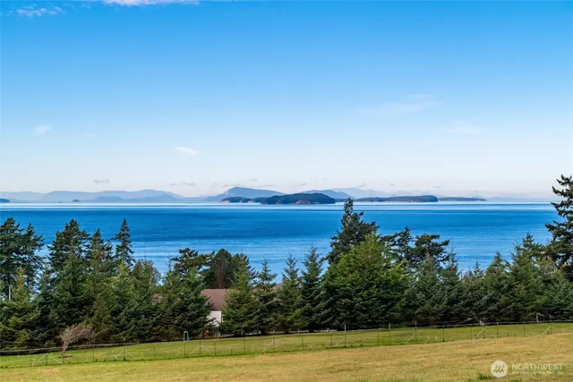 a view of a room with wooden floor and fence