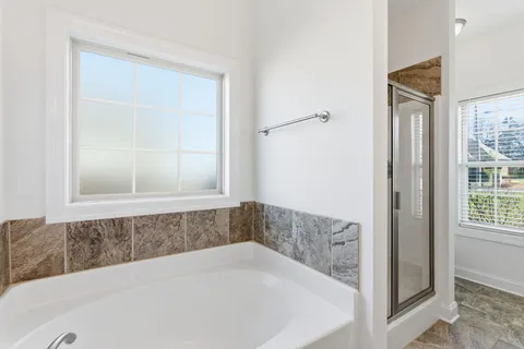 a white bath tub sitting in a bathroom