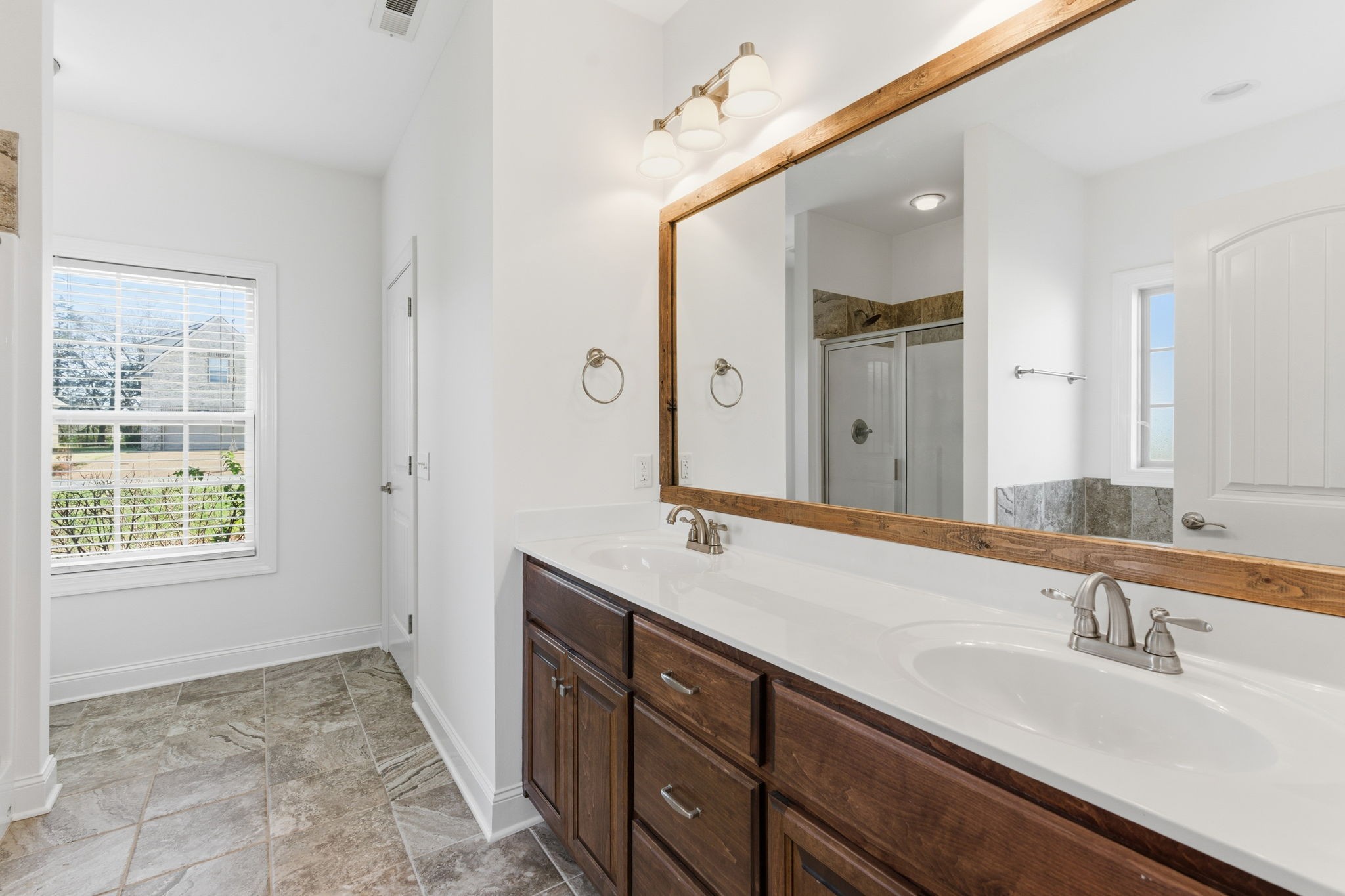 1246 Rimrock Road Smyrna, TN 37167 - Photo 23 of 36 a bathroom with a sink double vanity granite and a mirror
