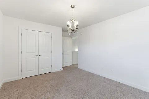 a view of a chandelier in big room
