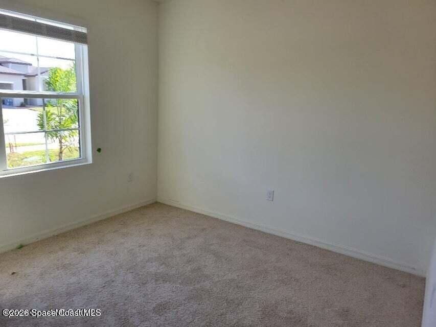 3619 Foggy Mist Road Southeast Palm Bay, FL 32909 - Photo 11 of 18 an empty room with a window