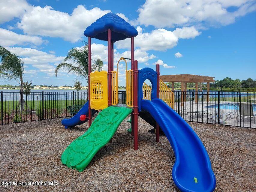 3619 Foggy Mist Road Southeast Palm Bay, FL 32909 - Photo 15 of 18 a view of a park with iron fence