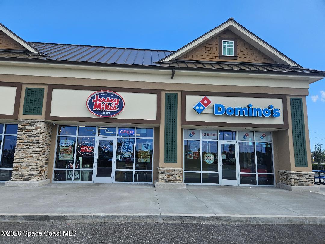 3619 Foggy Mist Road Southeast Palm Bay, FL 32909 - Photo 17 of 18 a view of a house with door
