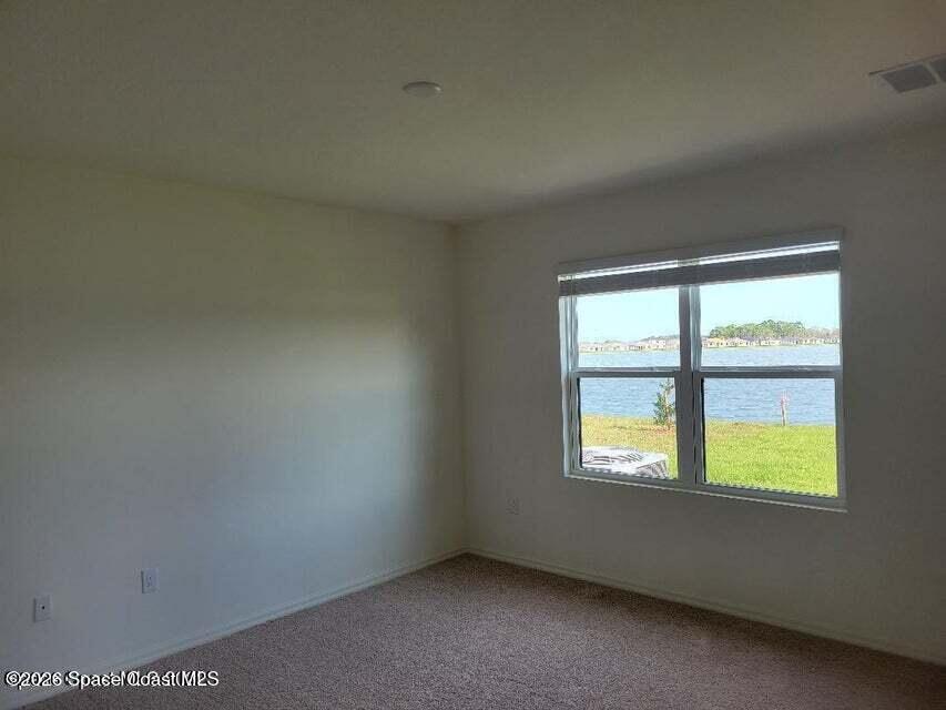 3619 Foggy Mist Road Southeast Palm Bay, FL 32909 - Photo 8 of 18 an empty room with a window