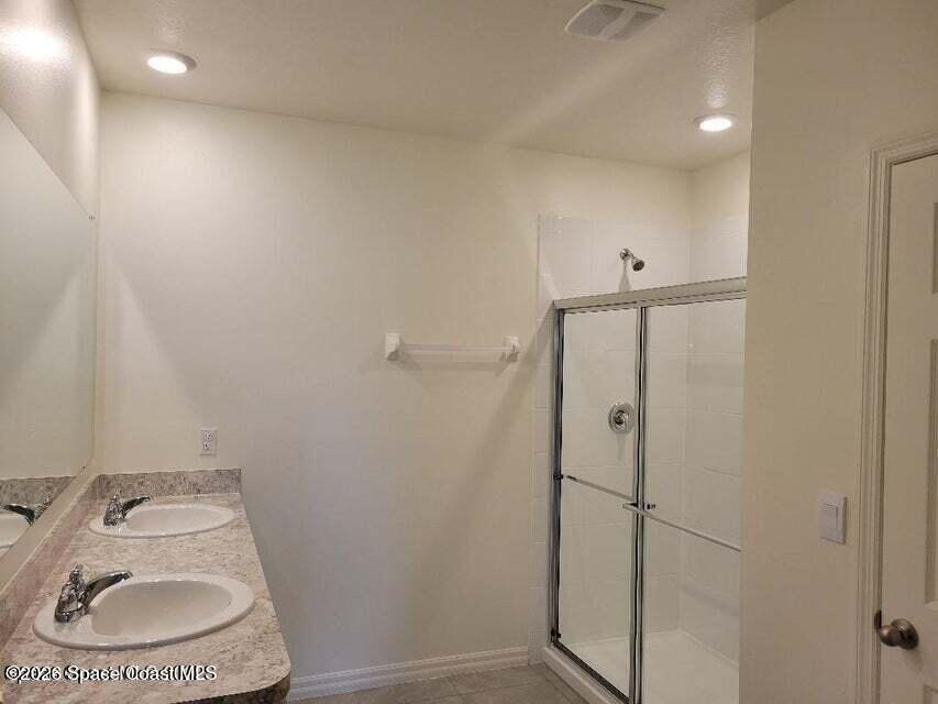 3619 Foggy Mist Road Southeast Palm Bay, FL 32909 - Photo 9 of 18 a bathroom with a toilet and a sink