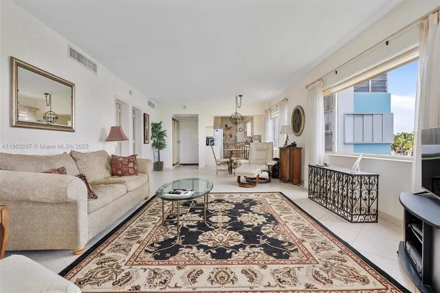 a living room with furniture and a rug