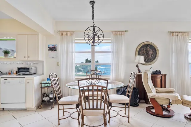 a view of a livingroom with furniture and a large window