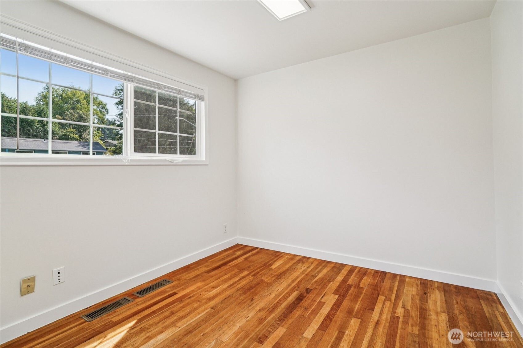 17841 4th Avenue Northwest Shoreline, WA 98177 - Photo 13 of 33 a view of empty room with wooden floor and fan