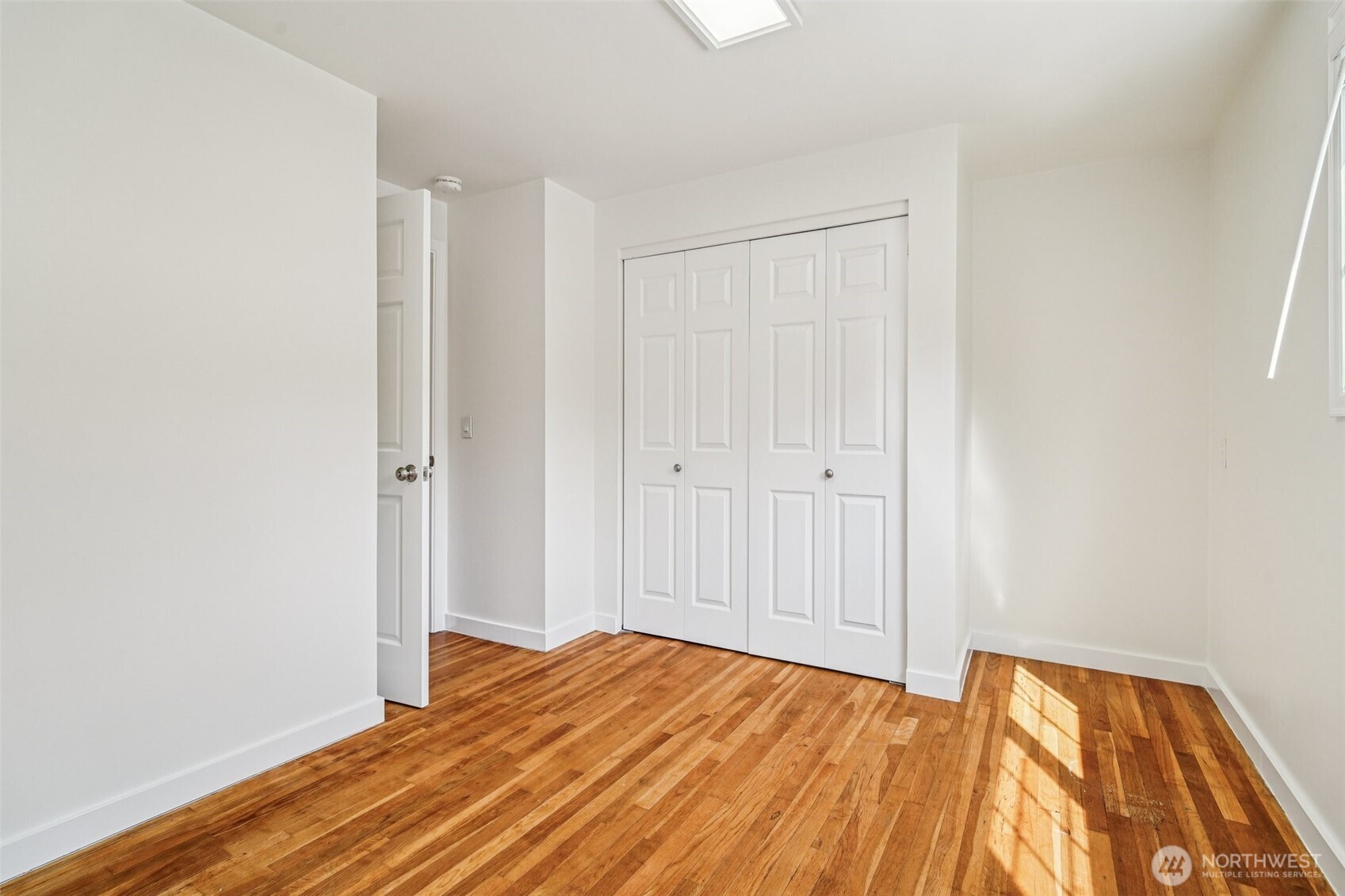 17841 4th Avenue Northwest Shoreline, WA 98177 - Photo 14 of 33 a view of a bedroom with wooden floor