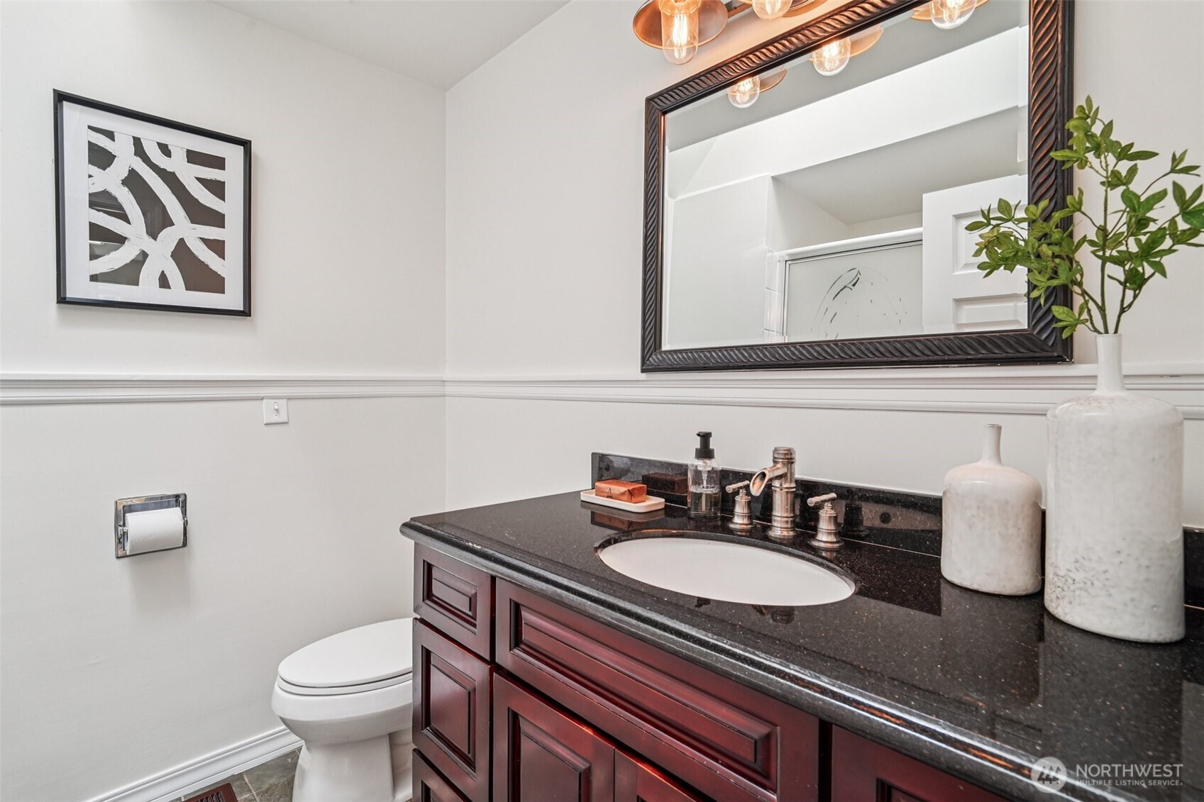 17841 4th Avenue Northwest Shoreline, WA 98177 - Photo 15 of 33 a bathroom with a granite countertop sink and a mirror