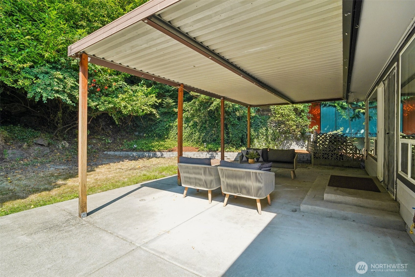 17841 4th Avenue Northwest Shoreline, WA 98177 - Photo 27 of 33 a view of a patio with a table chairs and backyard