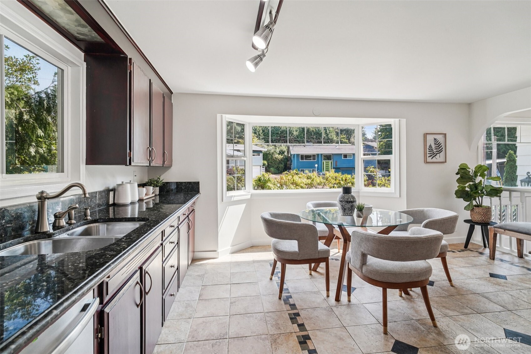 17841 4th Avenue Northwest Shoreline, WA 98177 - Photo 6 of 33 a kitchen with granite countertop lots of counter top space and dining table