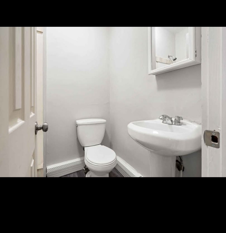 2 Kingsley Terrace, Unit 7 Lynn, MA 01902 - Photo 13 of 13 a bathroom with a sink toilet and a mirror