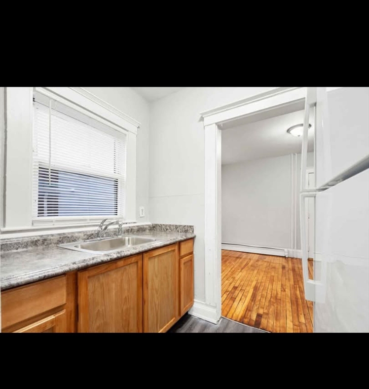 2 Kingsley Terrace, Unit 7 Lynn, MA 01902 - Photo 4 of 13 a view of an empty room with a window