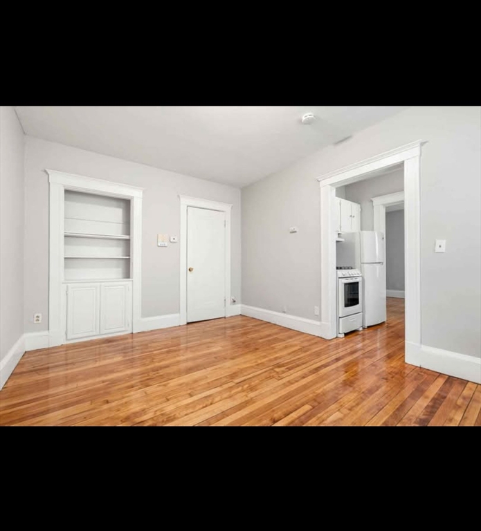 2 Kingsley Terrace, Unit 7 Lynn, MA 01902 - Photo 6 of 13 a view of empty room with wooden floor