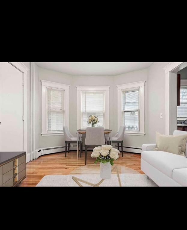 2 Kingsley Terrace, Unit 7 Lynn, MA 01902 - Photo 8 of 13 a living room with furniture and a window