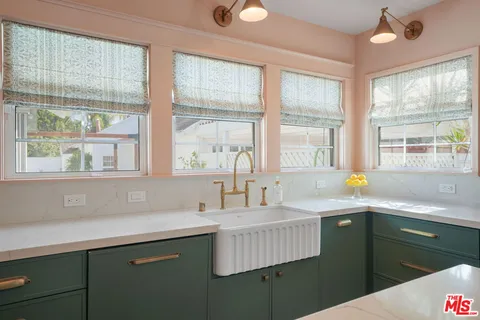 a kitchen with a stove and a sink