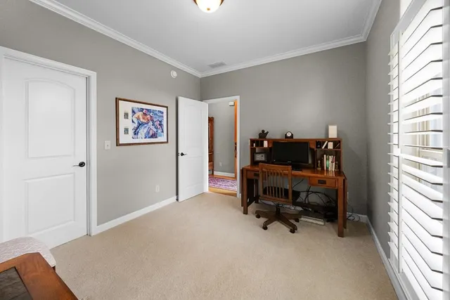 a bedroom with furniture and a window
