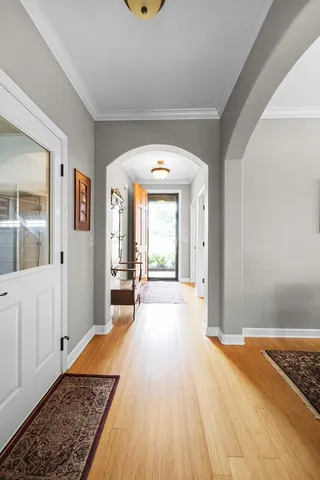 a big room with wooden floor and windows