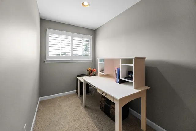 a workspace with furniture and window